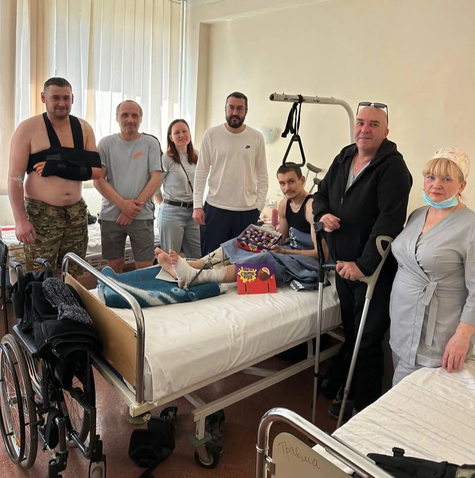 Soldier receiving sweets in hospital